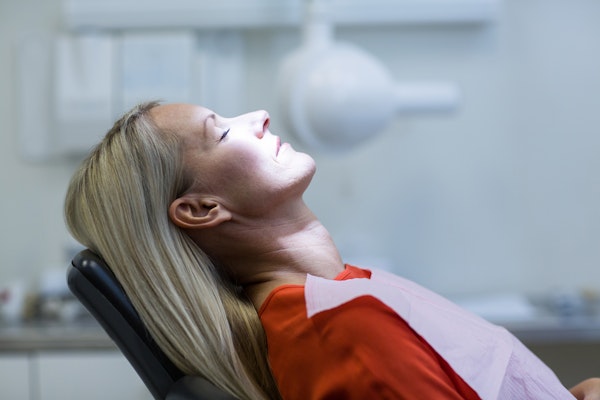 Woman relaxing in dental chair
