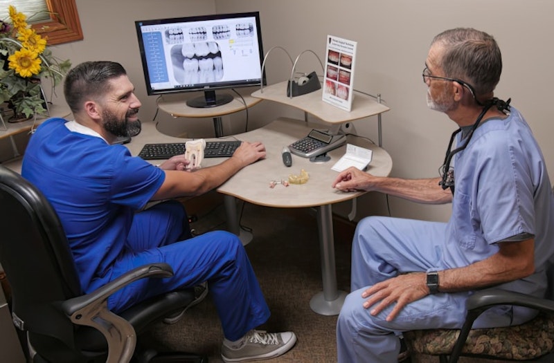 Our dentists viewing X-rays on a monitor