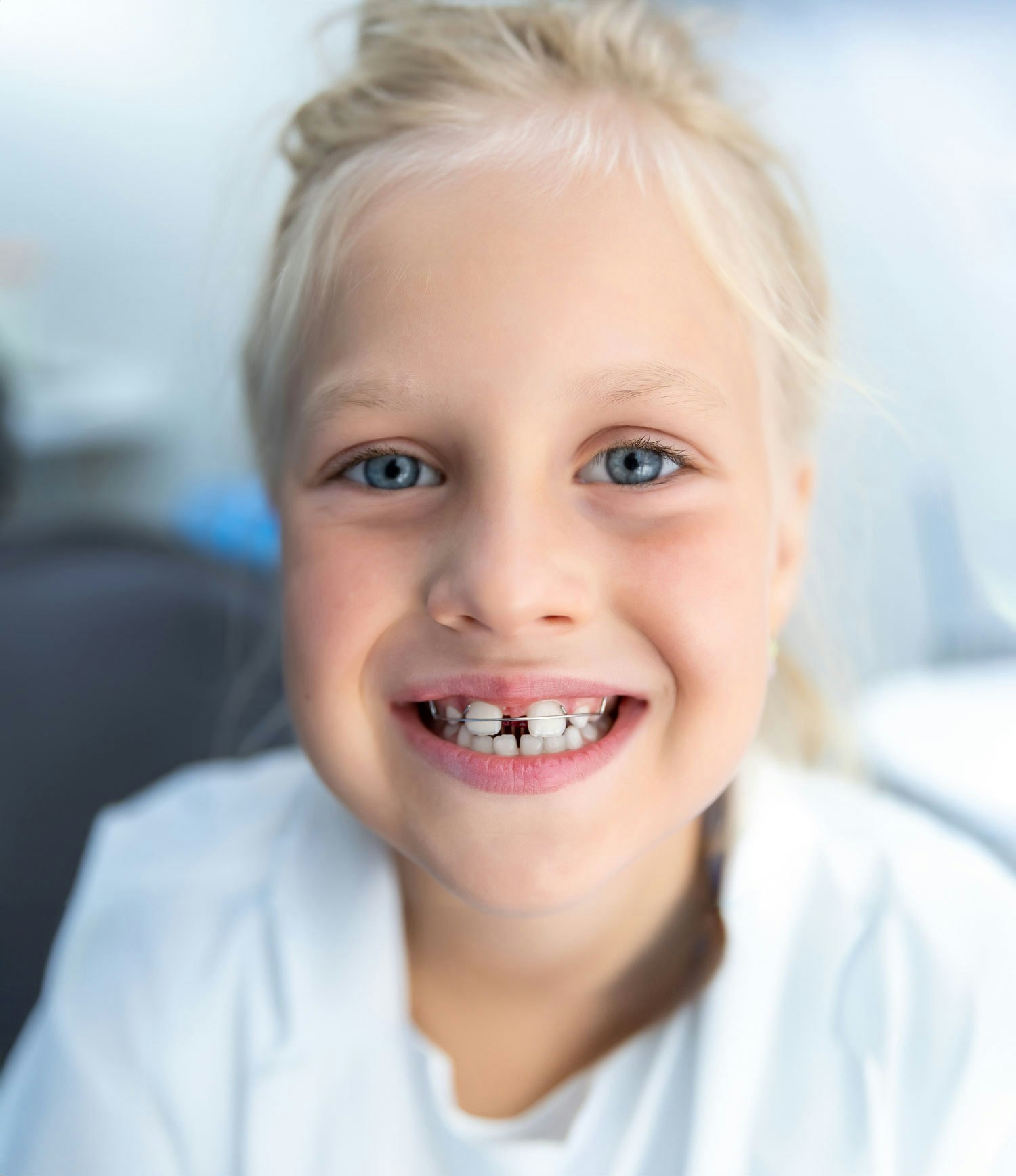 smiling child with orthodontia