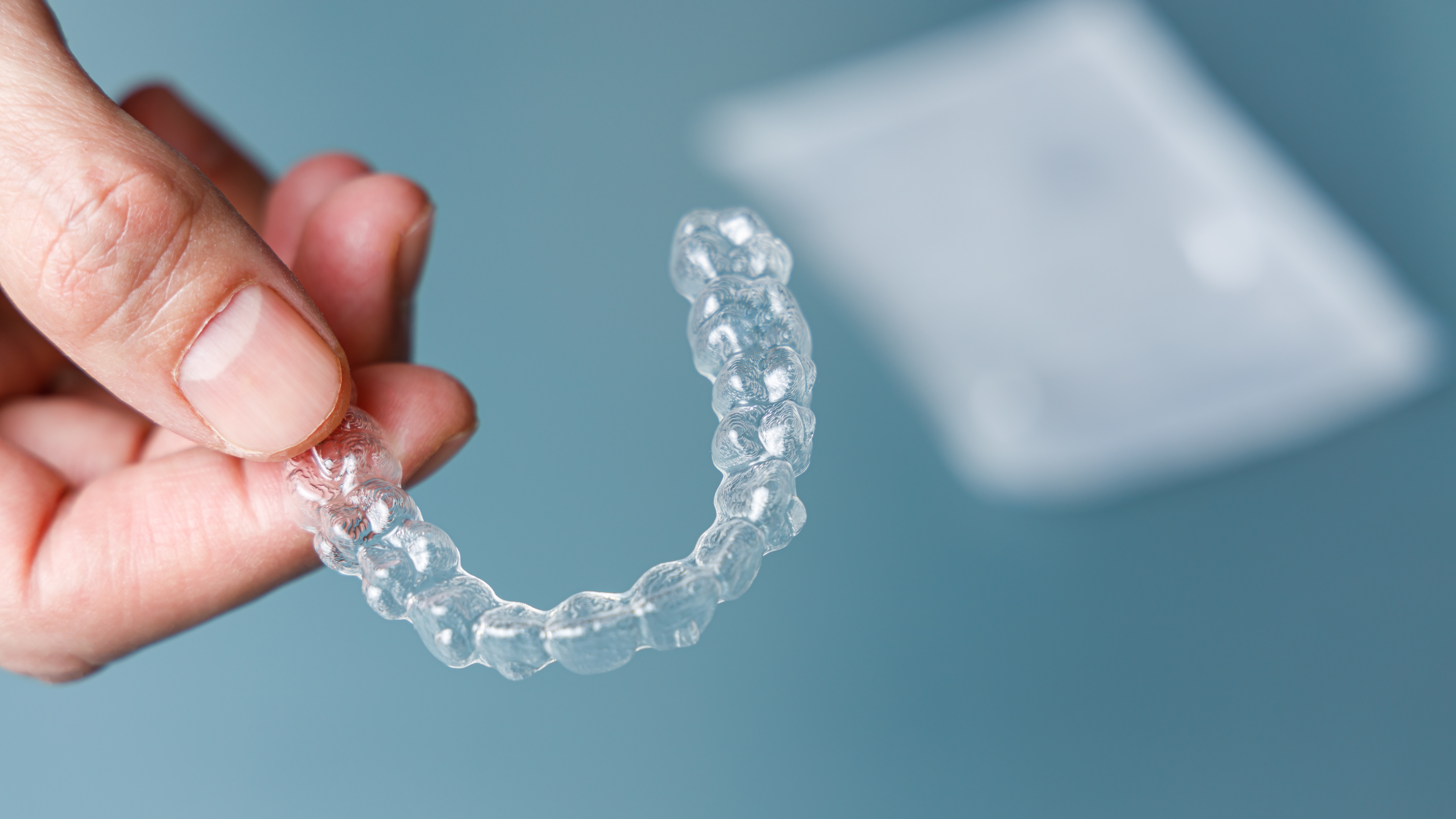 hand holding Invisalign