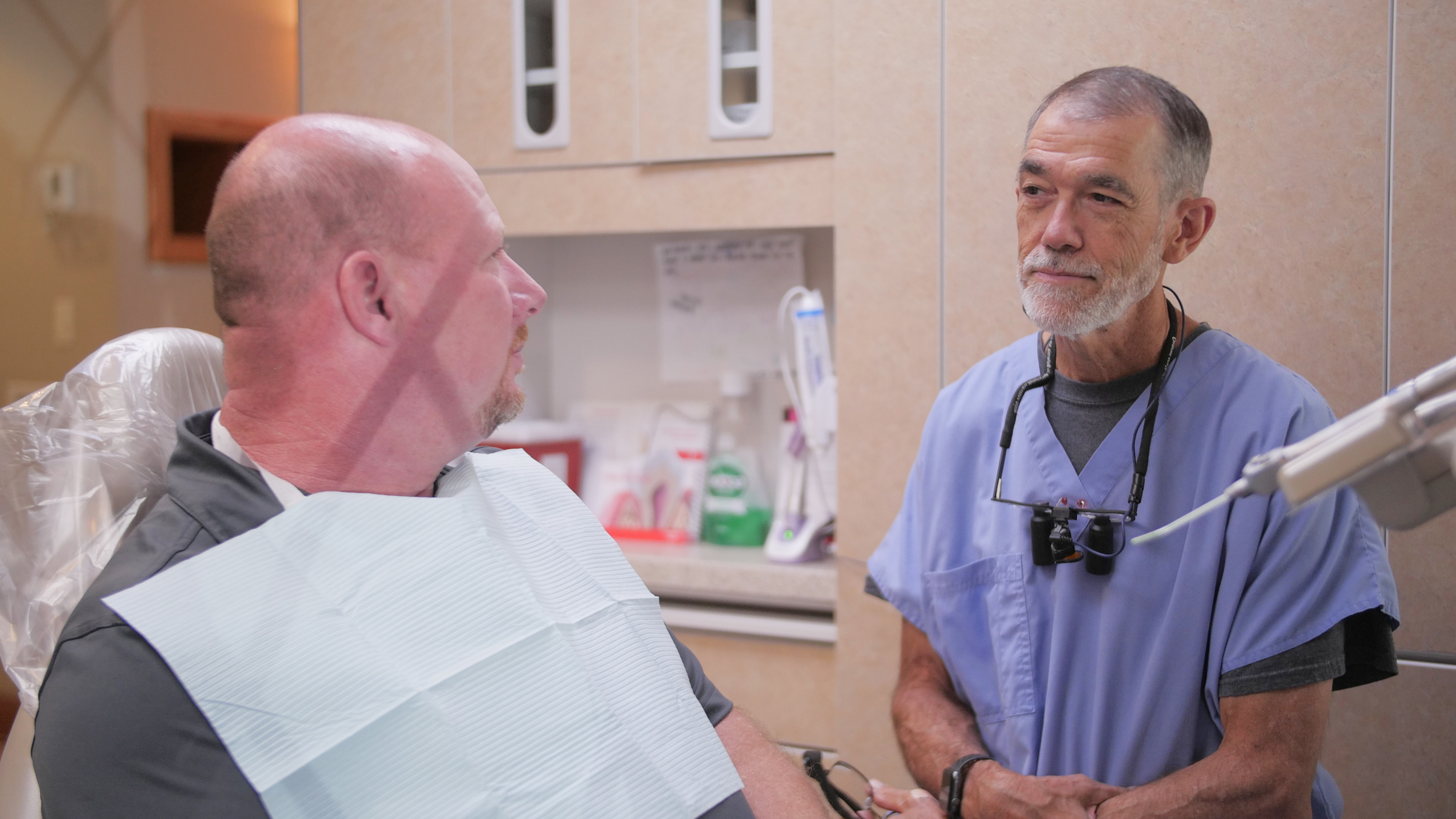 Dr. David Sutton wearing blue scrubs