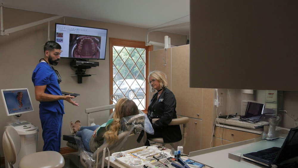 our dentist speaking with a patient