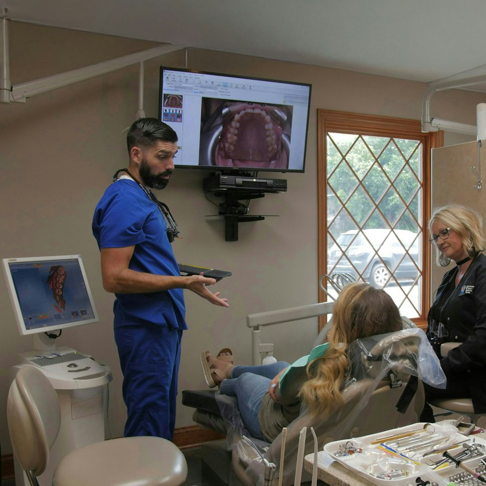 our dentist speaking with a patient