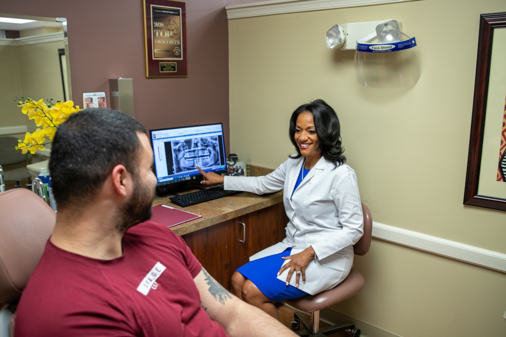 Dr. Hodges and Patient looking at x-ray
