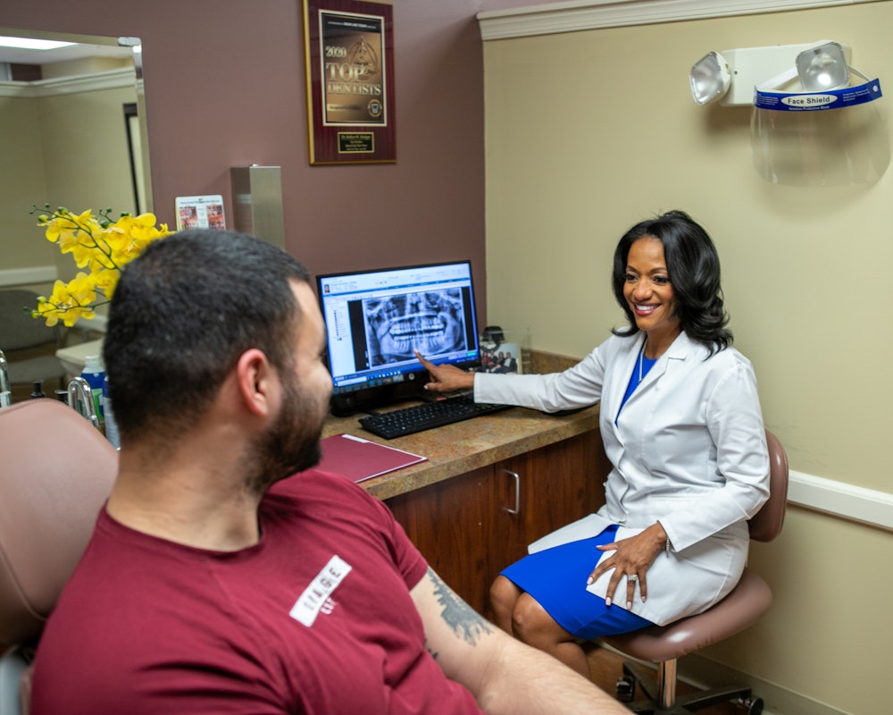 Dr. Hodges and Patient looking at x-ray