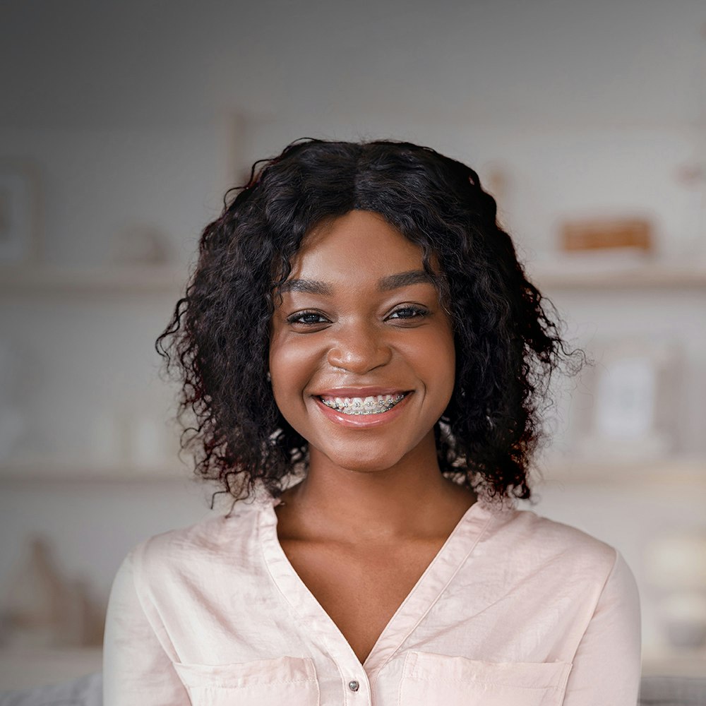 smiling young woman with braces