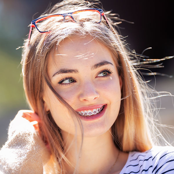 young girl smiling with braces