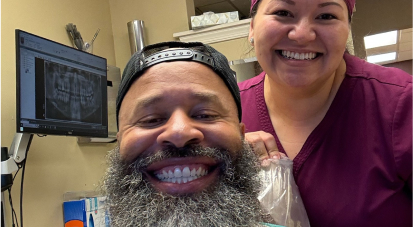 Dr. Hodges smiling patient after orthodontics
