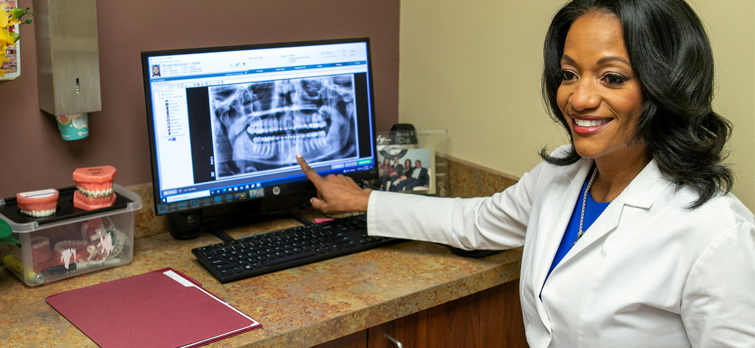 Dr. Hodges pointing to patient
