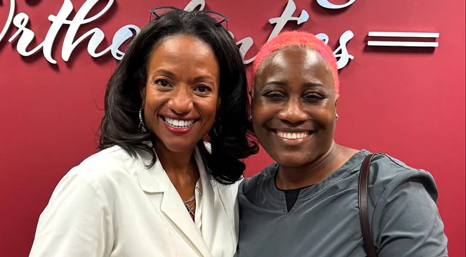 Dr. Hodges smiling with a patient