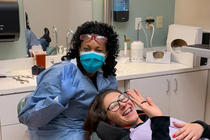 happy orthodontics patient with technician