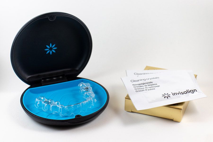Invisalign tray, holder, and cleaning crystals packets