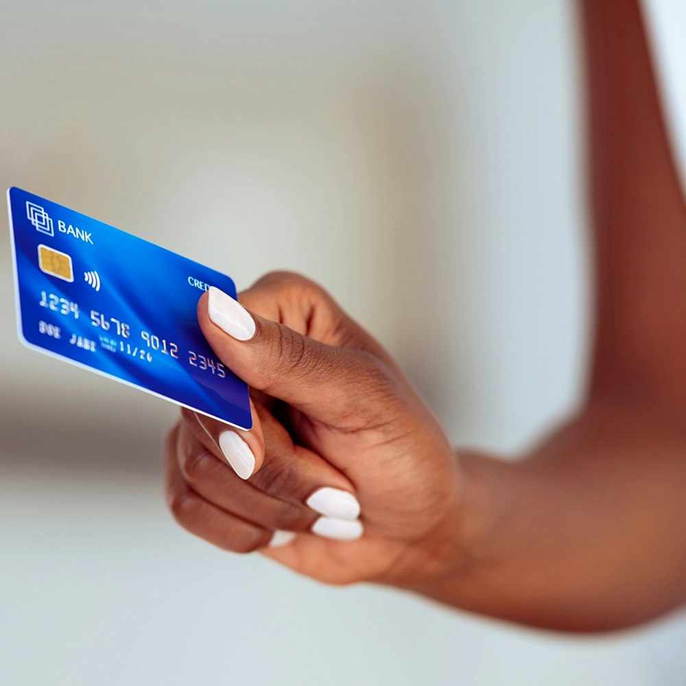 hand holding a credit card