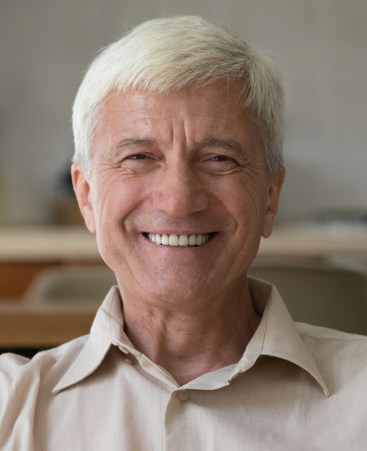 Smiling older man with nice teeth.