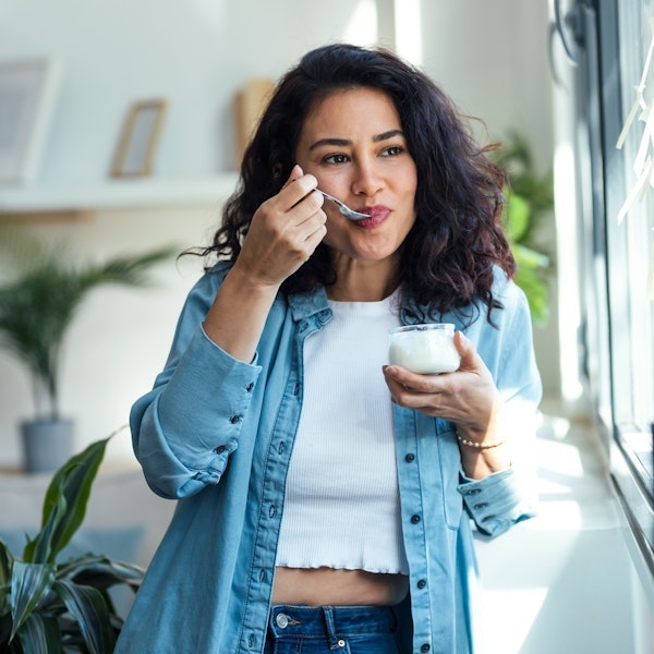 Woman eating yogurt after a root canal