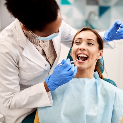 Woman getting dental exam