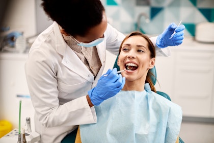 Woman getting dental exam
