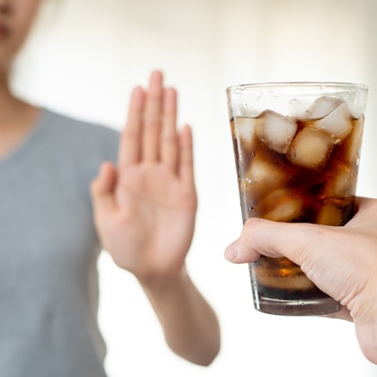 Woman refusing soda