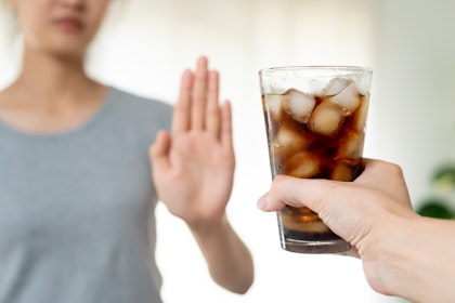 Woman refusing soda