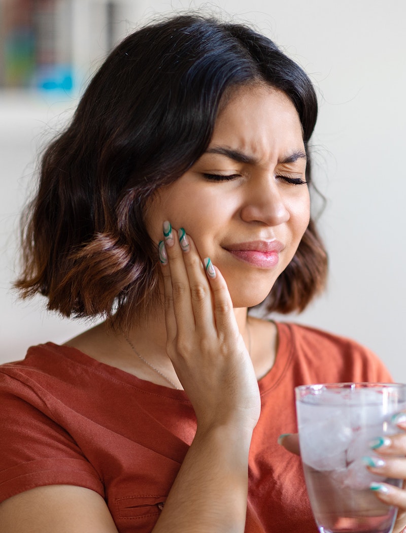 a woman experiencing tooth pain