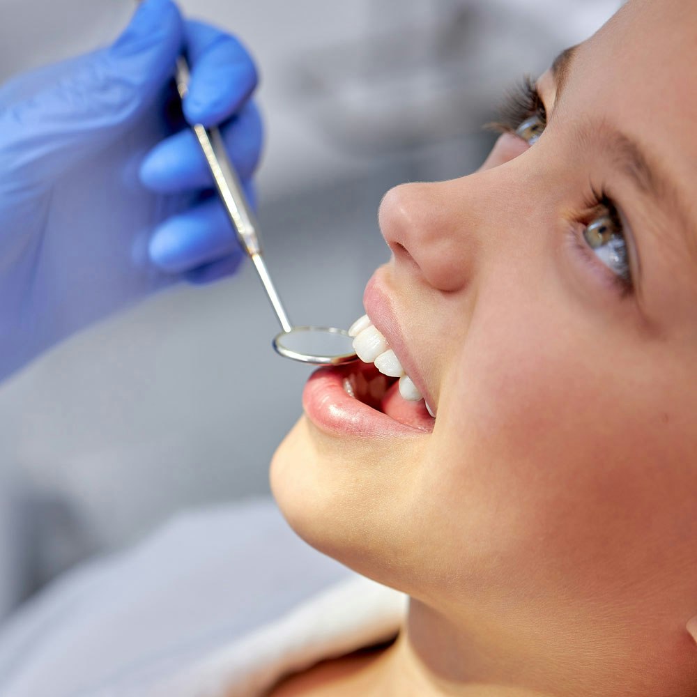 Woman receiving sealants