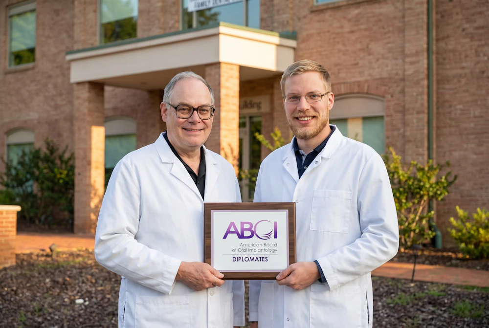 Drs. Kirksey and Simanek holding ABOI Diplomats certificate