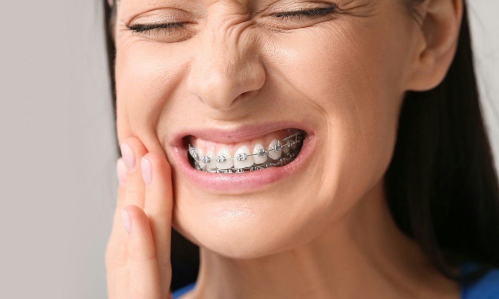 woman holding braces