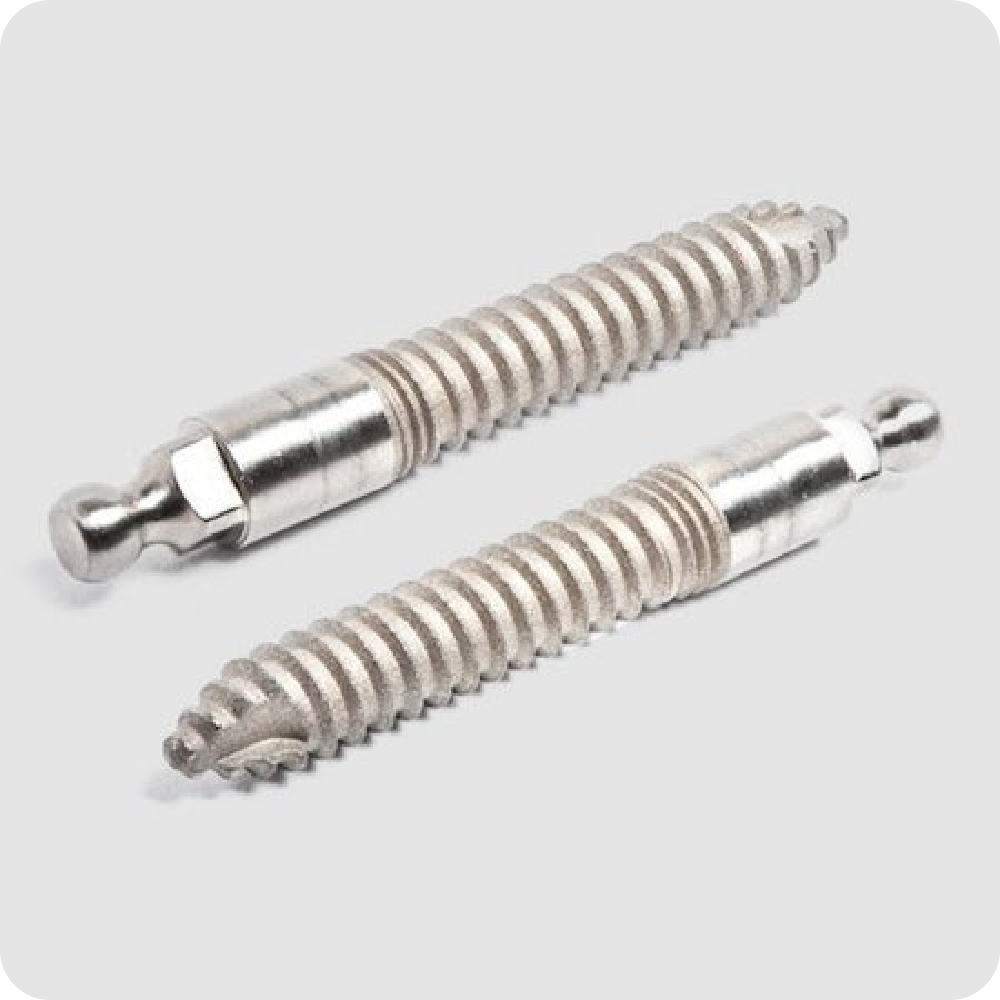 Close-up of two titanium mini dental implants on neutral background