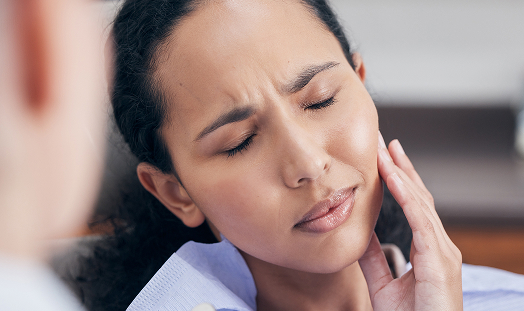 Woman experiencing tooth pain