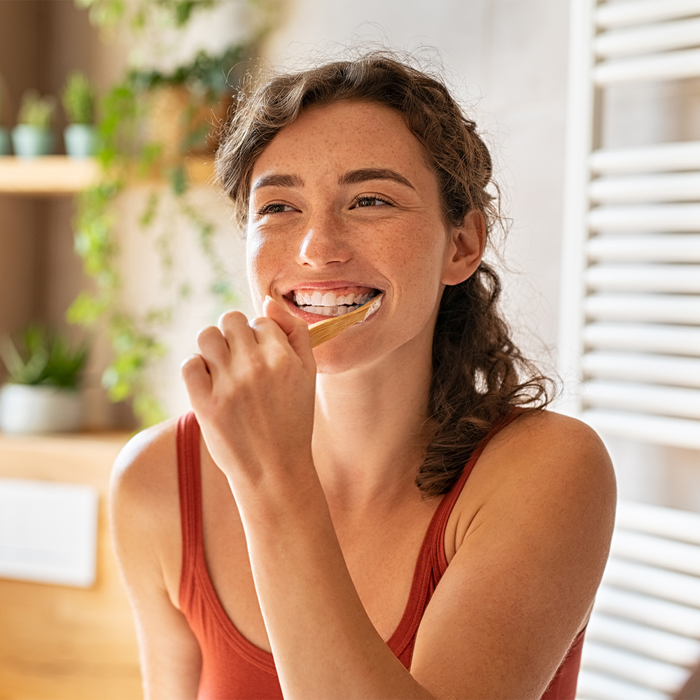 woman brushing her teeth