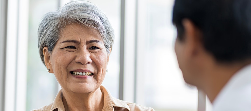 Smiling woman in a crown consultation