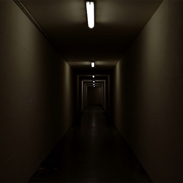 very dimly lit hallway