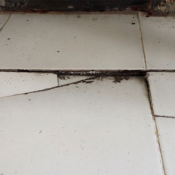 Cracked flooring due to uneven foundation