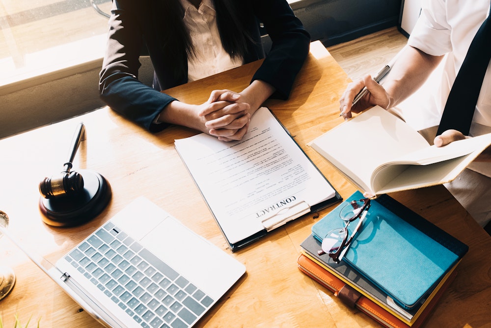 lawyer reviewing contract with client
