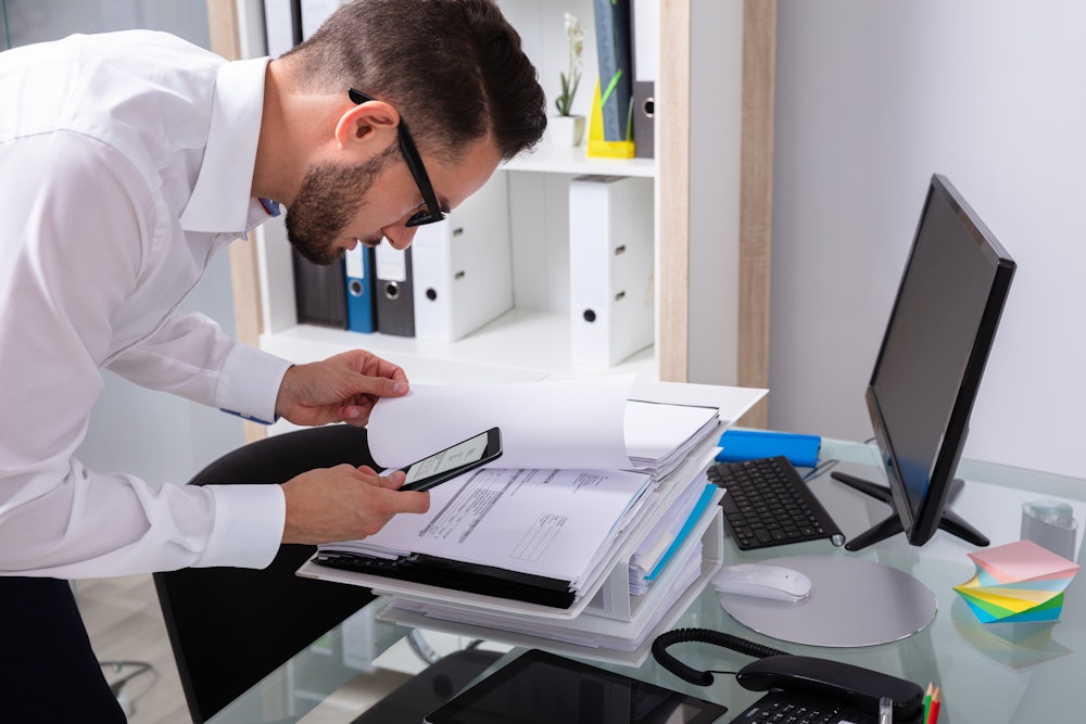Person sneaking pictures of documents