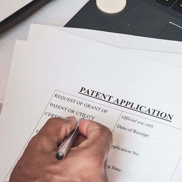 Person signing a patent application