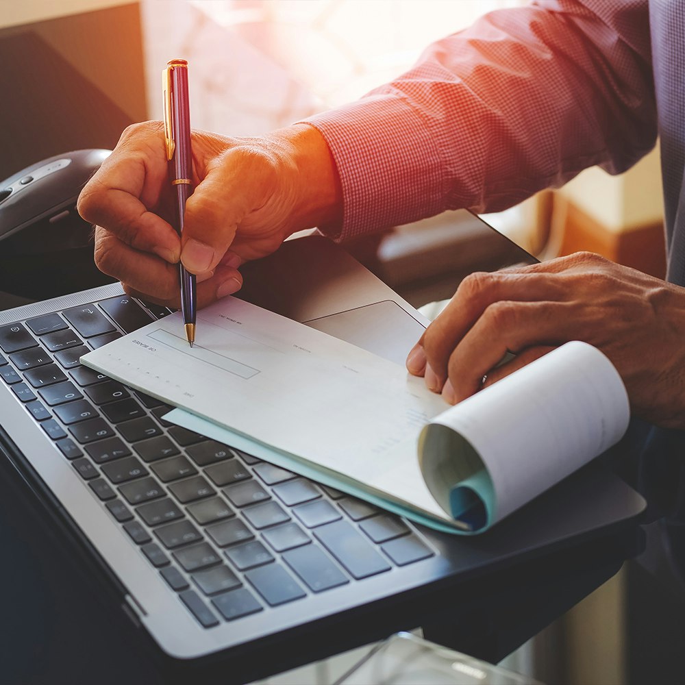 a man writing a check