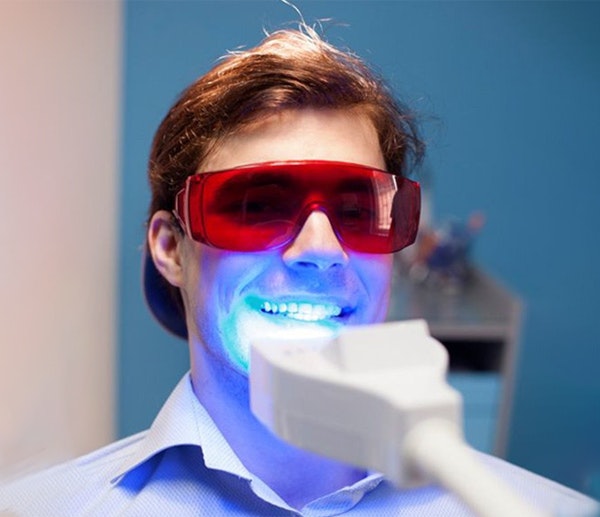 patient getting teeth whitening