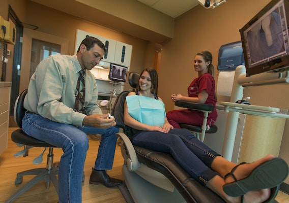 Dr. Tasch and a patient in a treatment room