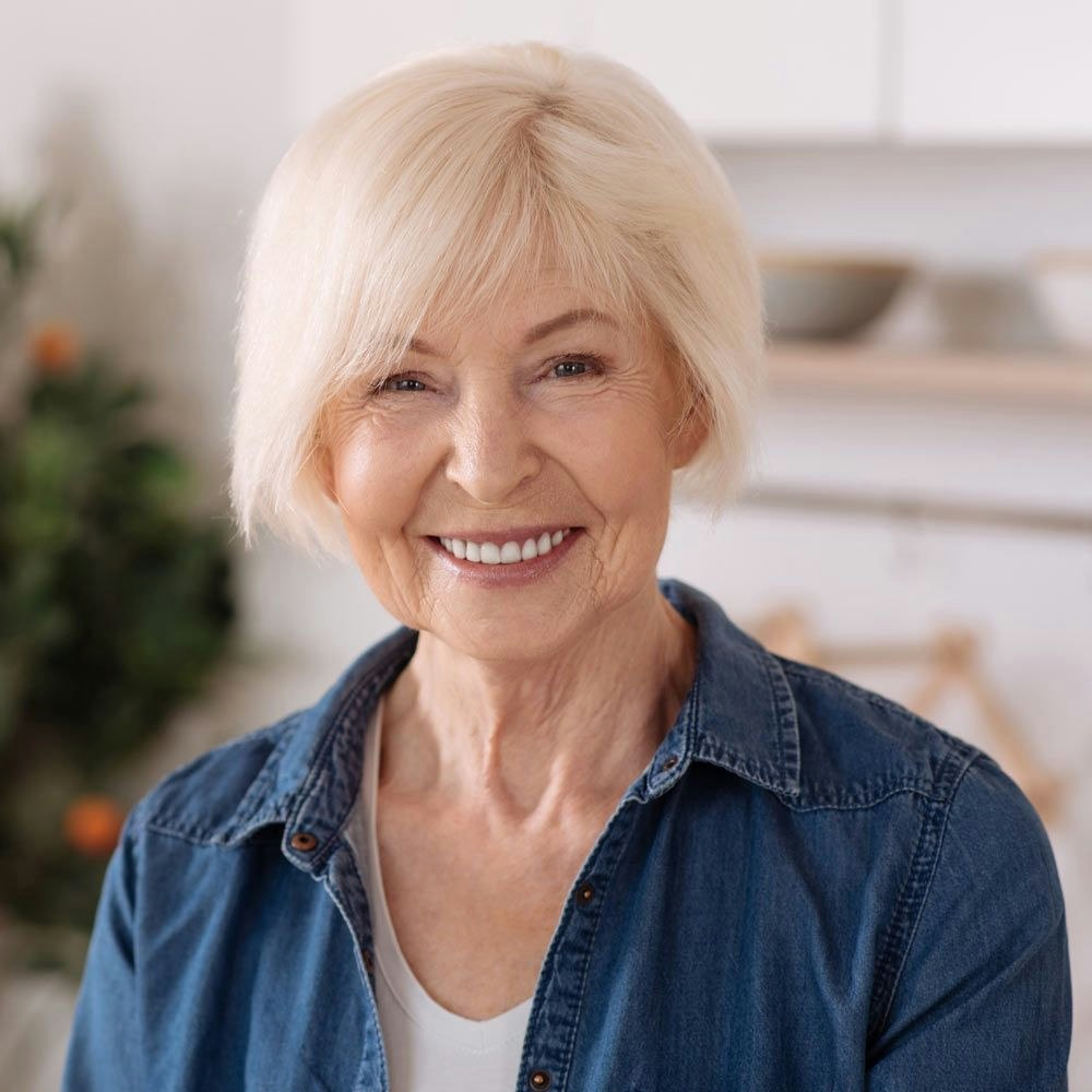 smiling woman after restorative dental treatment