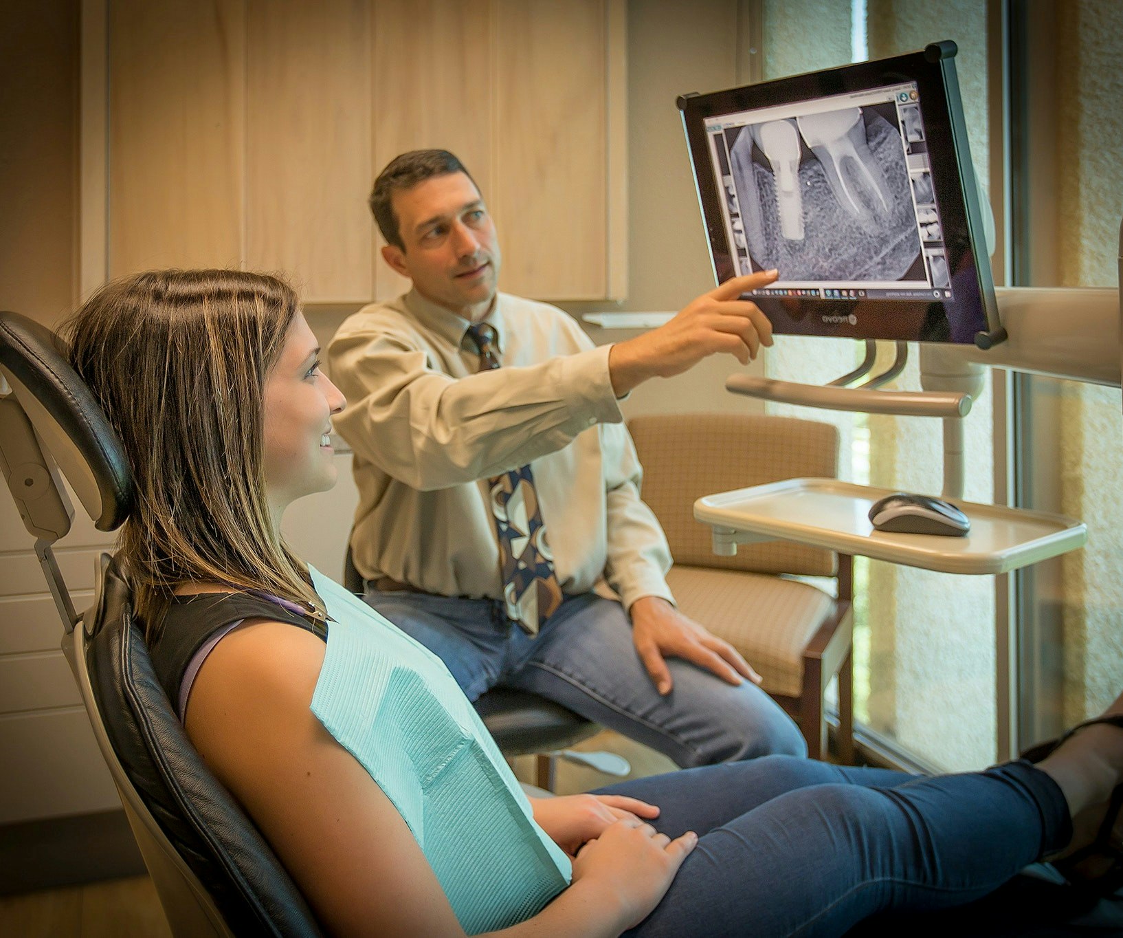 Dr. Tasch showing patient image on monitor