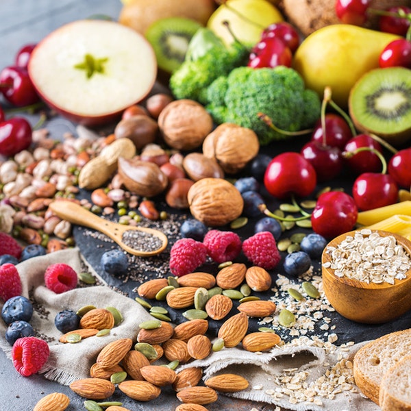 nuts, berries, oats, and vegetables on table