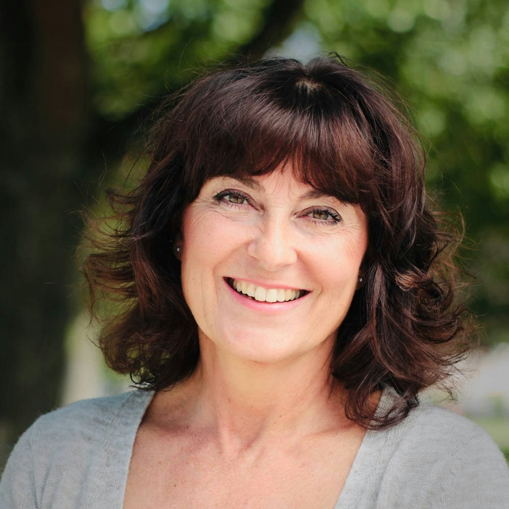 Smiling woman after gum disease treatment