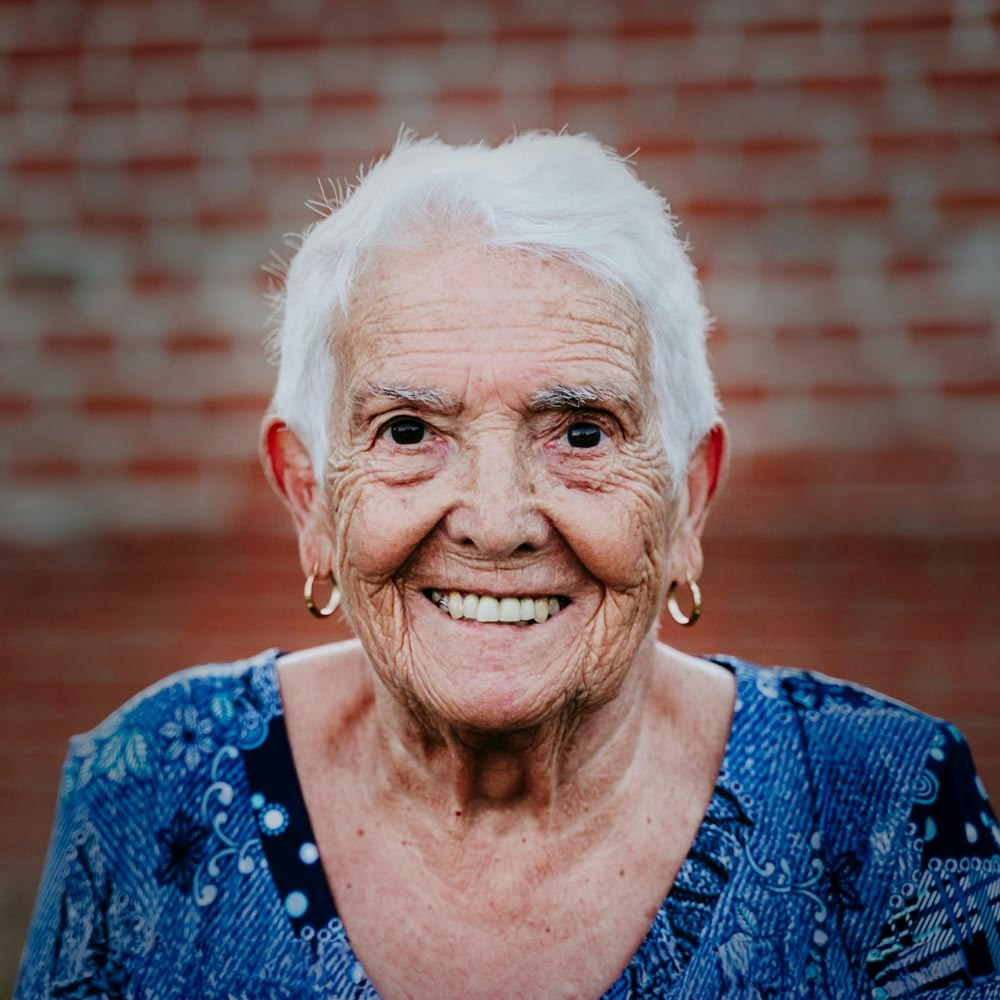 smiling elderly woman after restorative dentistry procedure
