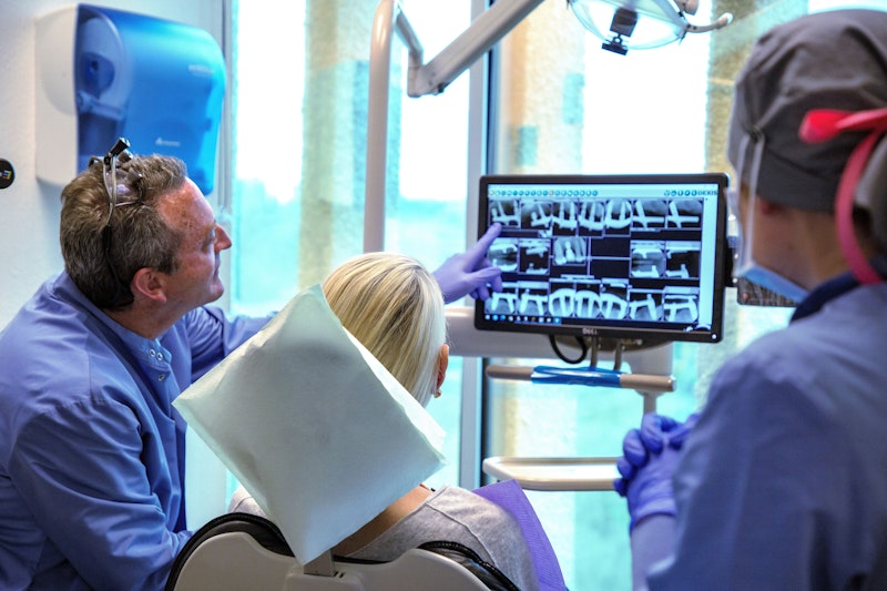 Dr. Meek going over x-ray result with patient