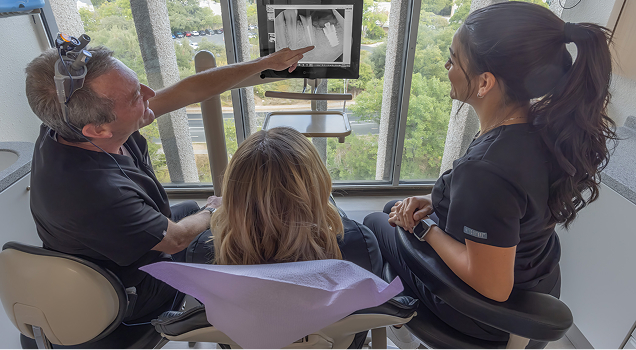 Dr. Meek meeting with a patient