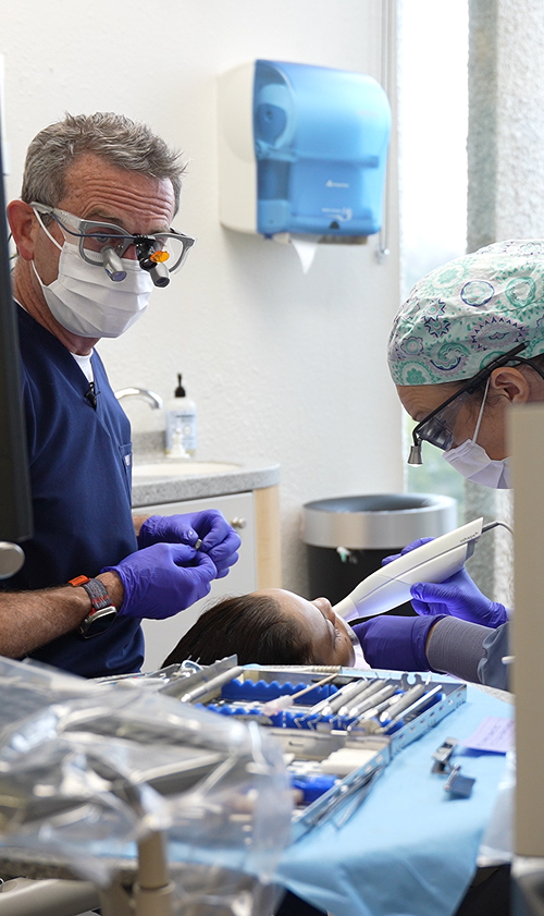 Dr. Meek working with a patient