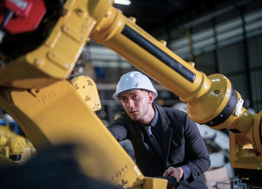 Man working robotic arm