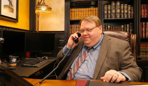 Attorney Gilbert Fisher on the phone