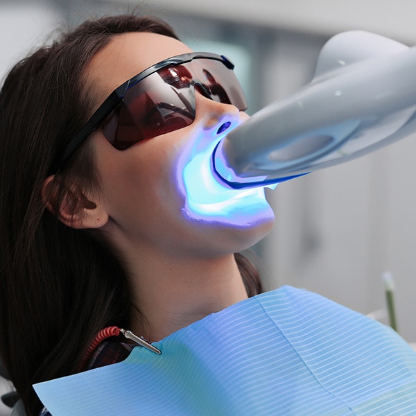 Patient getting teeth whitening treatment